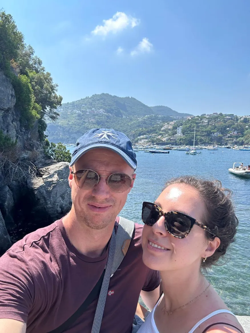 A client and his partner, making memories on the Mediterranean